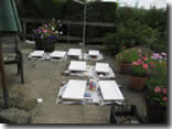Hand-painting all the kitchen units in the garden